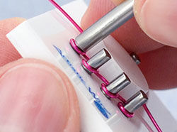 Wire pushed used on a peg